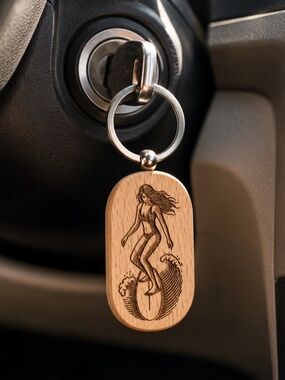 Wooden keychain with an engraved surfer girl design